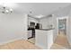 Modern kitchen with white cabinets, black countertops, and stainless steel appliances at 5207 Santa Fe Pkwy, Sandy Springs, GA 30350