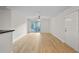 Large living room with new floors, sliding door and entrance door at 5207 Santa Fe Pkwy, Sandy Springs, GA 30350