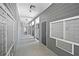 Indoor mailbox area featuring silver boxes, gray walls, and overhead lighting at 5207 Santa Fe Pkwy, Sandy Springs, GA 30350