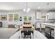 Bright dining area with a view of the backyard, seamlessly connected to the modern kitchen at 5696 Walnut Mill Ln, Powder Springs, GA 30127