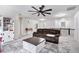 Carpeted loft with ceiling fan, sofa, coffee table and shelves at 5696 Walnut Mill Ln, Powder Springs, GA 30127