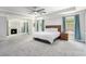 Spacious carpeted main bedroom with fireplace, bed, and ensuite bath at 5696 Walnut Mill Ln, Powder Springs, GA 30127