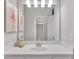 Bathroom sink with ballerina artwork visible in the mirror and view of shelving unit at 6179 Ashbranch Dr, Acworth, GA 30101