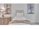 Comfortable bedroom featuring a cozy bed and stylish ballerina artwork on the white walls at 6179 Ashbranch Dr, Acworth, GA 30101