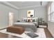 Bright bedroom features stylish decor, tray ceiling, and natural light at 6179 Ashbranch Dr, Acworth, GA 30101