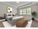 Bright bedroom features stylish decor, tray ceiling, and large windows that provide natural light at 6179 Ashbranch Dr, Acworth, GA 30101