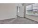 Bright bedroom with a large window providing natural light and neutral decor at 6179 Ashbranch Dr, Acworth, GA 30101