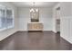 Dining Room features wainscotting, chandelier and dark hardwood floors at 6179 Ashbranch Dr, Acworth, GA 30101