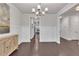 Dining Room features wainscotting, chandelier and dark hardwood floors at 6179 Ashbranch Dr, Acworth, GA 30101