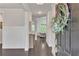 Entryway features wainscotting, console table, and view into home at 6179 Ashbranch Dr, Acworth, GA 30101