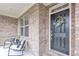 Front porch features chairs and decorative wreath at 6179 Ashbranch Dr, Acworth, GA 30101