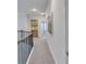 Hallway featuring neutral decor, art, and access to additional rooms in the home at 6179 Ashbranch Dr, Acworth, GA 30101