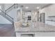Kitchen island with granite countertops, seating, and stainless steel sink at 6179 Ashbranch Dr, Acworth, GA 30101