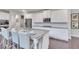 Spacious kitchen with granite counters, island, stainless appliances and white cabinets at 6179 Ashbranch Dr, Acworth, GA 30101