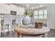 View of the kitchen island with white cabinets and stainless steel appliances in the background at 6179 Ashbranch Dr, Acworth, GA 30101