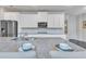 Modern kitchen island featuring granite countertops, stainless steel appliances, and ample cabinet space at 6179 Ashbranch Dr, Acworth, GA 30101