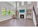Bright living room with large windows, fireplace, high ceilings, and hardwood floors at 6179 Ashbranch Dr, Acworth, GA 30101