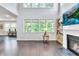 Spacious living room with abundant natural light and fireplace at 6179 Ashbranch Dr, Acworth, GA 30101