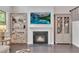 Elegant living room featuring a fireplace, built-in shelves, and hardwood floors at 6179 Ashbranch Dr, Acworth, GA 30101