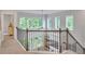 Bright airy loft area with large windows overlooks the lower level and backyard at 6179 Ashbranch Dr, Acworth, GA 30101