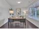 Well-lit home office with a large window, elegant desk, and stylish decor at 6179 Ashbranch Dr, Acworth, GA 30101