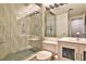 Bathroom with glass shower and decorative tile and granite countertops at 1 Biscayne Drive Nw # 706, Atlanta, GA 30309