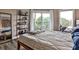 Bright bedroom with a view through sliding glass doors leading to a balcony at 1 Biscayne Drive Nw # 706, Atlanta, GA 30309