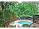 Community pool surrounded by lounge chairs and greenery at 1 Biscayne Drive Nw # 706, Atlanta, GA 30309
