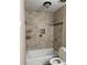 Bathroom with tiled shower and updated fixtures at 106 Plantation Dr, Clarkston, GA 30021