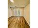 Spacious living room featuring laminate flooring and sliding doors at 106 Plantation Dr, Clarkston, GA 30021