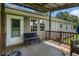 Inviting covered back porch with outdoor seating, perfect for relaxing at 487 Laney Rd, Locust Grove, GA 30248