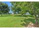 Beautiful backyard with mature trees providing shade, ideal for relaxation at 487 Laney Rd, Locust Grove, GA 30248