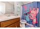Bathroom features a vanity with a sink, a toilet, and a shower at 487 Laney Rd, Locust Grove, GA 30248