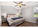 Bedroom featuring a ceiling fan, bright natural light, and modern decor at 487 Laney Rd, Locust Grove, GA 30248