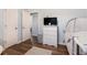 Bright bedroom with wood floors, white dresser, and TV at 487 Laney Rd, Locust Grove, GA 30248