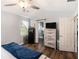 Spacious bedroom with plank flooring, natural light, and ensuite bathroom at 487 Laney Rd, Locust Grove, GA 30248