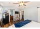 This spacious bedroom has vaulted ceilings, a ceiling fan, and luxury vinyl plank flooring at 487 Laney Rd, Locust Grove, GA 30248