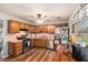 Well lit kitchen features stainless steel appliances, wooden cabinets, and a window at 487 Laney Rd, Locust Grove, GA 30248