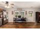 Eat-in kitchen featuring warm wood accents, stainless steel appliances, and checkered curtains at 487 Laney Rd, Locust Grove, GA 30248