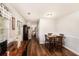 Eat-in kitchen featuring warm wood accents, stainless steel appliances, and hardwood floors at 487 Laney Rd, Locust Grove, GA 30248