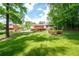 Expansive backyard showcasing a home with a deck and plentiful green space at 655 Stone Harbor Sw Pkwy, Marietta, GA 30060