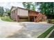Two-story brick home with an attached garage, backyard deck and long driveway at 655 Stone Harbor Sw Pkwy, Marietta, GA 30060