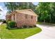 Charming brick home with manicured lawn and mature shrubbery at 655 Stone Harbor Sw Pkwy, Marietta, GA 30060