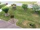 Well-maintained front yard features a lush lawn, mature trees and manicured shrubbery at 655 Stone Harbor Sw Pkwy, Marietta, GA 30060