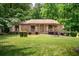 Lovely brick home with attractive landscaping, a vibrant green lawn and a welcoming curb appeal at 655 Stone Harbor Sw Pkwy, Marietta, GA 30060