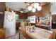 Eat-in kitchen with wood cabinets and a ceiling fan. Breakfast area seating at 655 Stone Harbor Sw Pkwy, Marietta, GA 30060