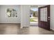 Bright entryway featuring wood-look flooring, views to other houses, and neutral paint at 116 Crooked Lake Park, Villa Rica, GA 30180