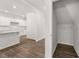 A view into a walk-in pantry with white shelving and wood floors at 116 Crooked Lake Park, Villa Rica, GA 30180