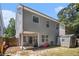 Charming backyard with a covered patio and exterior storage shed at 1232 Candler Ct, Morrow, GA 30260