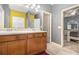En-suite bathroom featuring double sinks, and wood cabinets at 1232 Candler Ct, Morrow, GA 30260